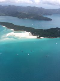 High angle view of sea against blue sky