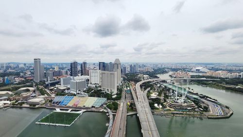 High angle view of cityscape against cloudy sky