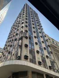 Low angle view of modern building against sky