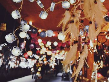 Multi colored lanterns hanging on wall