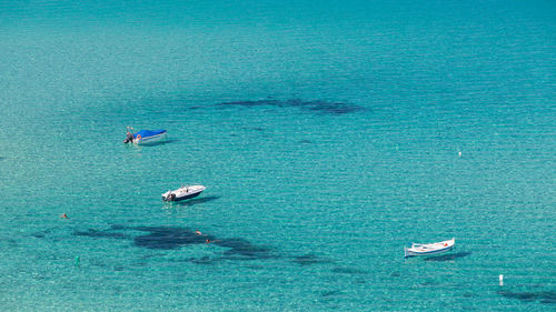 High angle view of boat sailing in sea