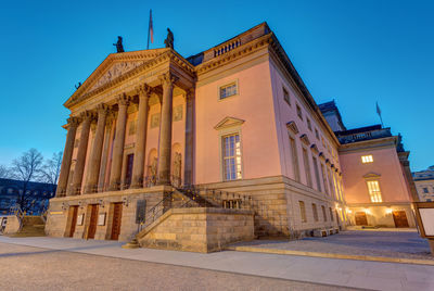 The berlin state opera at the unter den linden boulevard at dawn