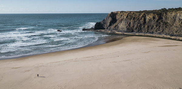 Scenic view of beach against clear sky