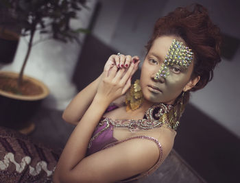 Close-up portrait of beautiful woman at home