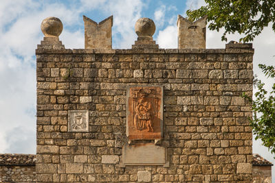 Low angle view of old ruins against sky