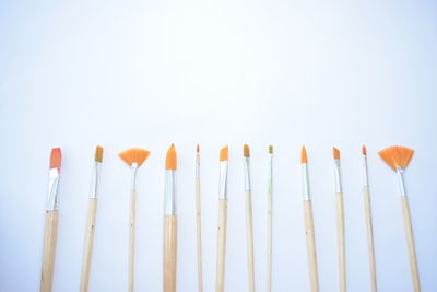 Close-up of multi colored pencils against white background