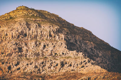 Scenic view of rocky mountains against clear sky