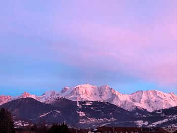 Scenic view of snowcapped mountains against sky during winter