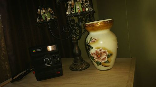 Close-up of electric lamp on table