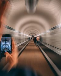 Blurred motion of people walking in subway station