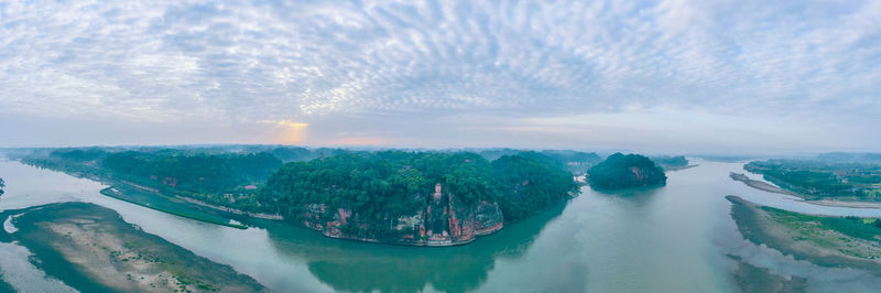 Panoramic view of sea against cloudy sky