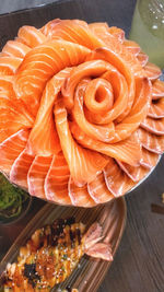 High angle view of orange fish in plate on table