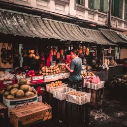 People at market stall