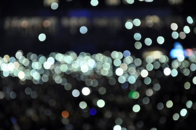 Defocused image of illuminated lights at night