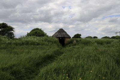 House on field against sky