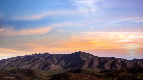 Scenic view of mountains against sky during sunset