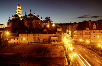 Illuminated buildings in city at night