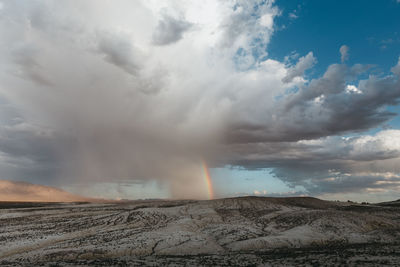 Rainbow in desert storm clouds