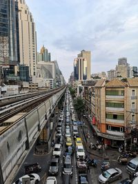 High angle view of city street and buildings against sky