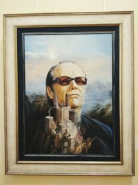 Portrait of man with sunglasses on window
