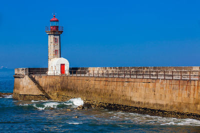 Historical felgueiras lighthouse built on 1886 and located at douro river mouth in porto city