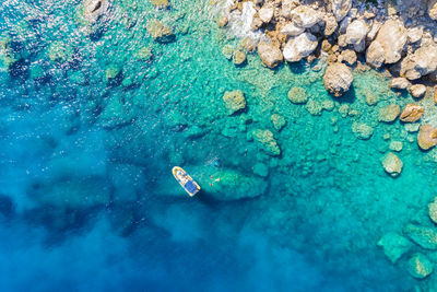 High angle view of rocks in sea