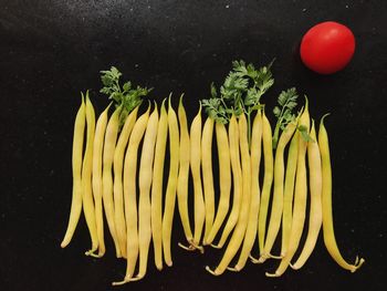 High angle view of fruits against black background