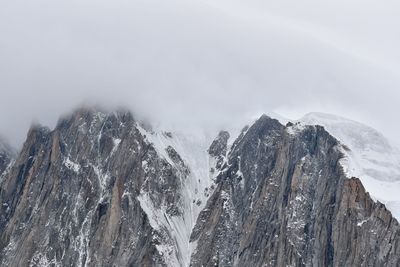 Scenic view of mountains against sky during winter
