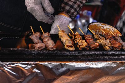 Man preparing food on barbecue grill