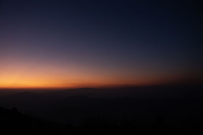 Scenic view of silhouette mountain against sky during sunset