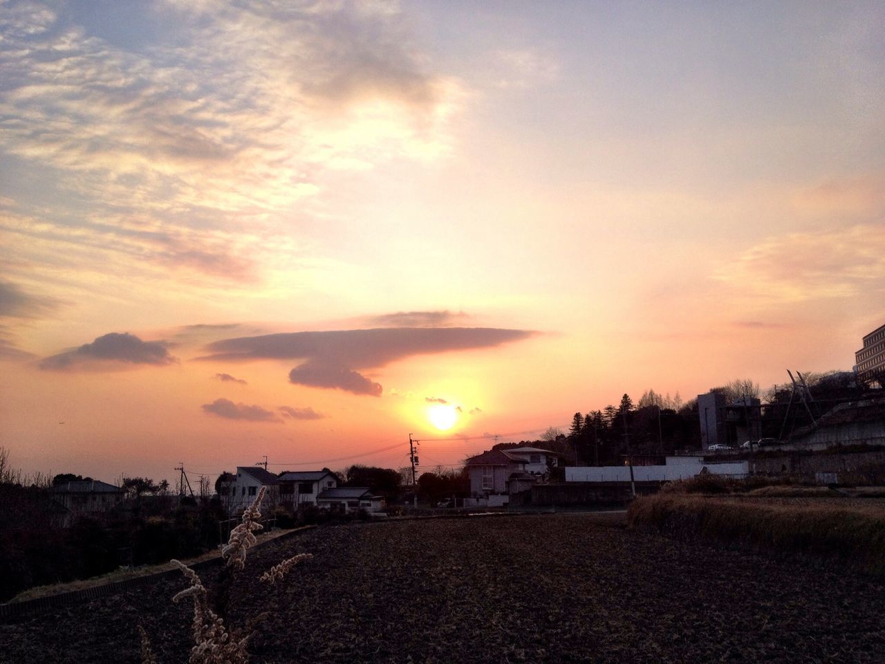 sunset, orange color, sun, sky, scenics, cloud - sky, beauty in nature, tranquil scene, built structure, building exterior, architecture, tranquility, beach, nature, sunlight, idyllic, sea, water, cloud, outdoors