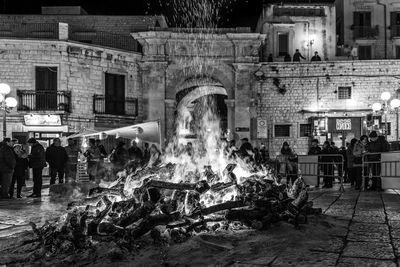 Group of people in front of building at night