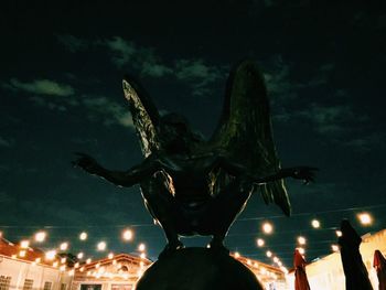 Statue of liberty against sky at night