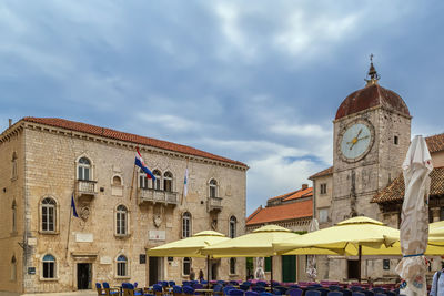 Central square with town hall and clock tower in trogir, croatia