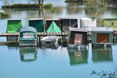 Boats moored in lake