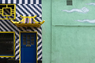 Exterior pattern wall with a door in chinatown. facade of chinese building