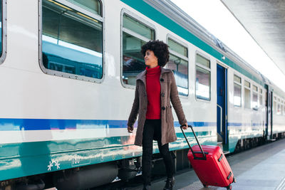 Tourist woman going for vacation trip on train