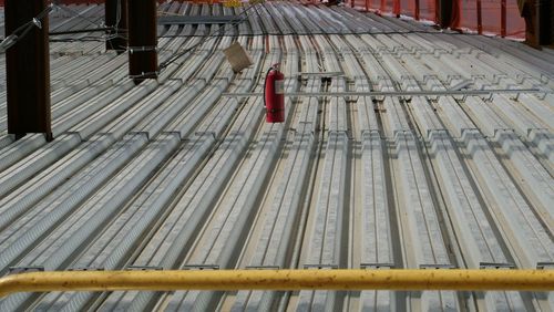 High angle view of red umbrella on railing
