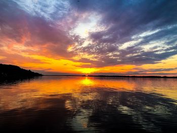 Scenic view of sea against romantic sky at sunset