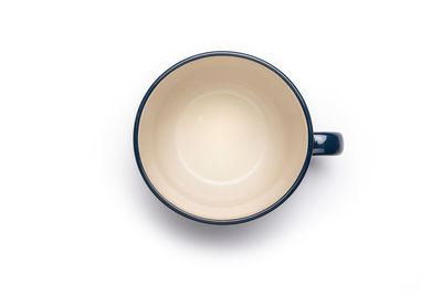 High angle view of tea cup against white background