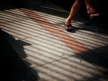 Low section of woman on floor