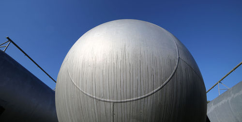 Low angle view of factory against sky