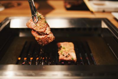 Close-up of meat on barbecue grill