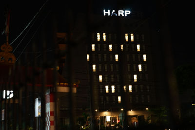 Low angle view of illuminated building at night