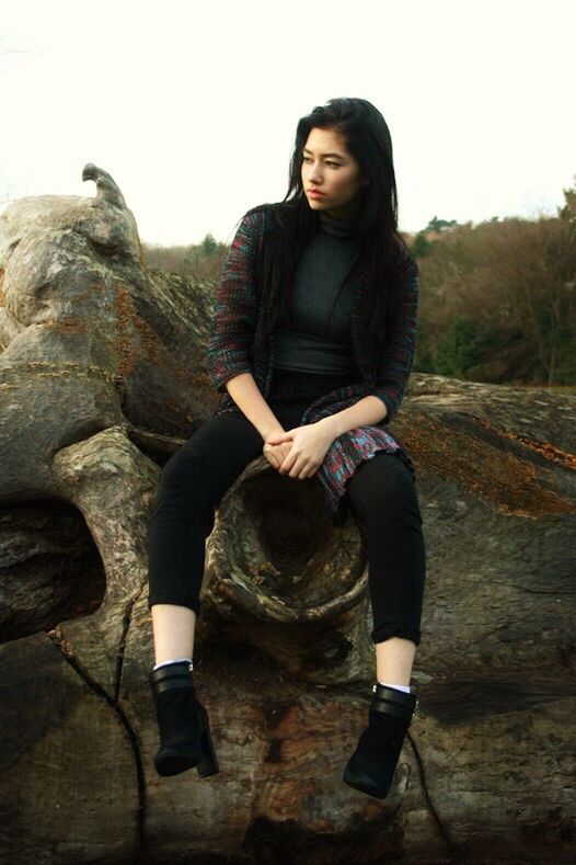 sitting, full length, one person, front view, one woman only, adults only, only women, outdoors, adult, people, happiness, smiling, portrait, day, young adult