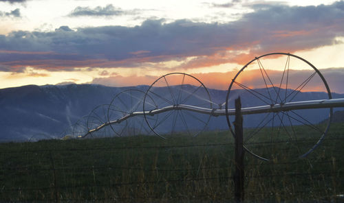 Scenic view of field against sky during sunset