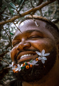 Man with an amazing smile and flowery beards