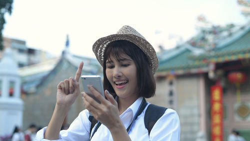 Portrait of woman using mobile phone