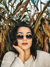 Portrait of young woman wearing sunglasses