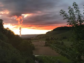Scenic view of landscape against sky during sunset